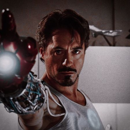 Tony Stark aiming with his weapon